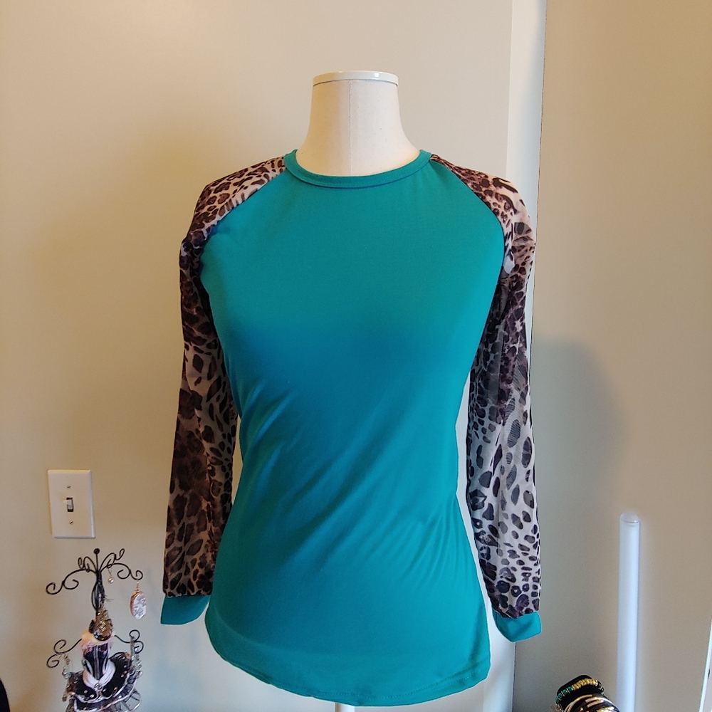 New light teal top with leopard sleeves